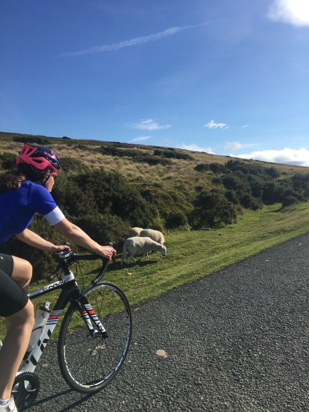 Female Cyclist cycling on World's End, North Wales