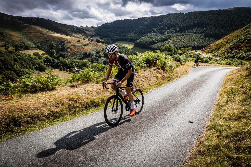 Cyclist riding uphill near Ponderosa Cafe