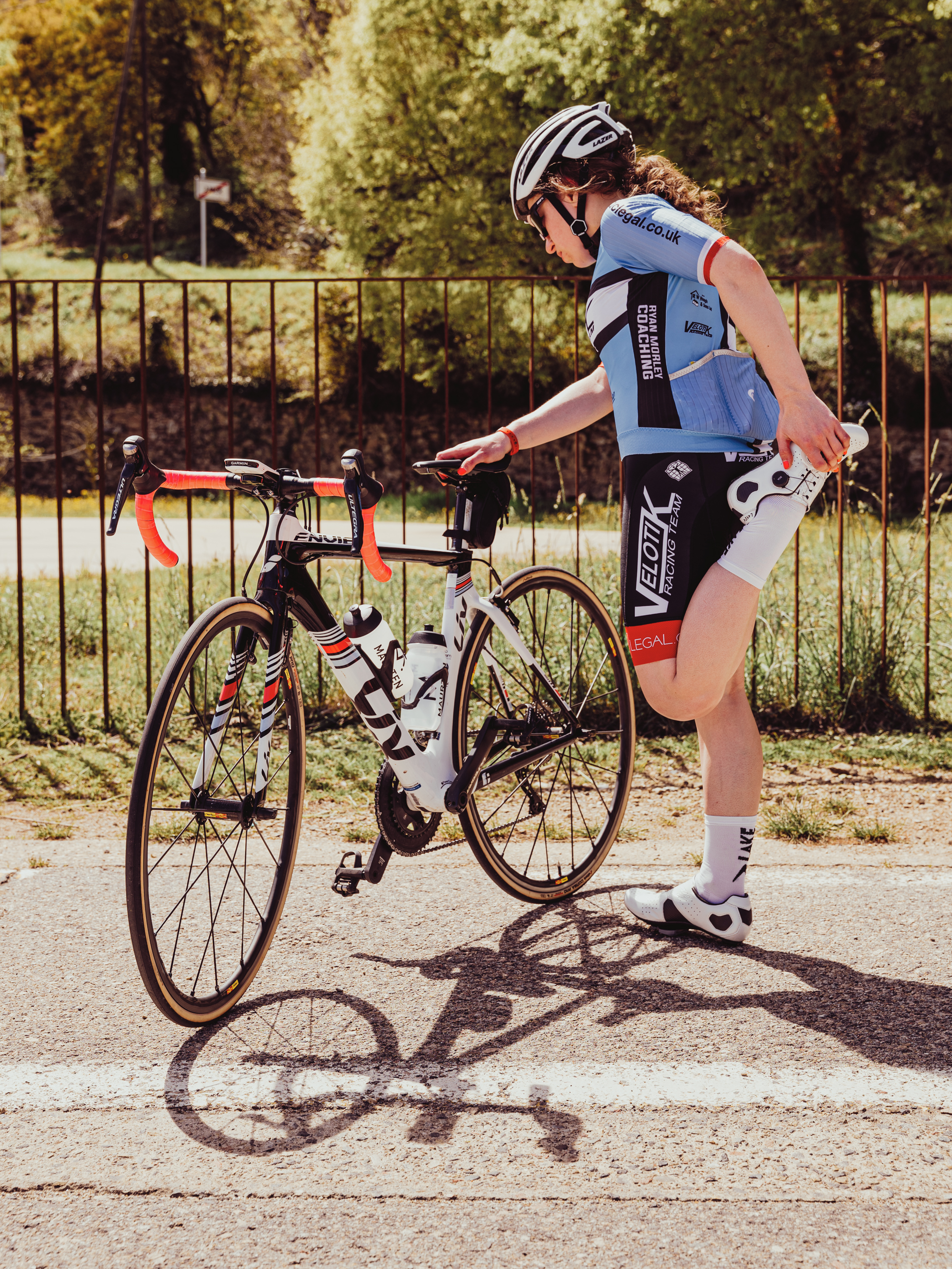 Female cyclist stretching in Girona